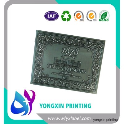 Custom embossed metal label for wine bottle